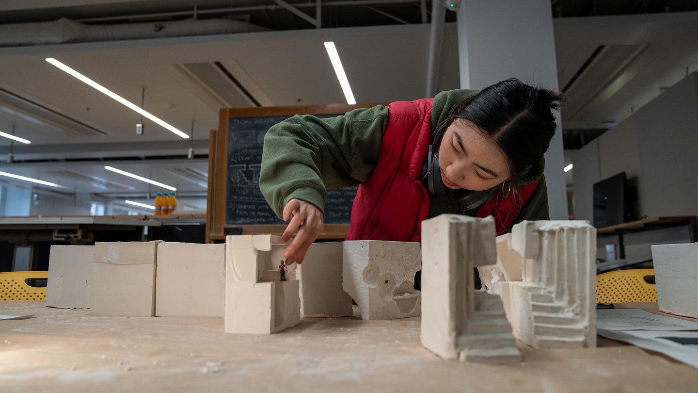 architecture student working on a model