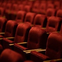 empty, red seats in a theater