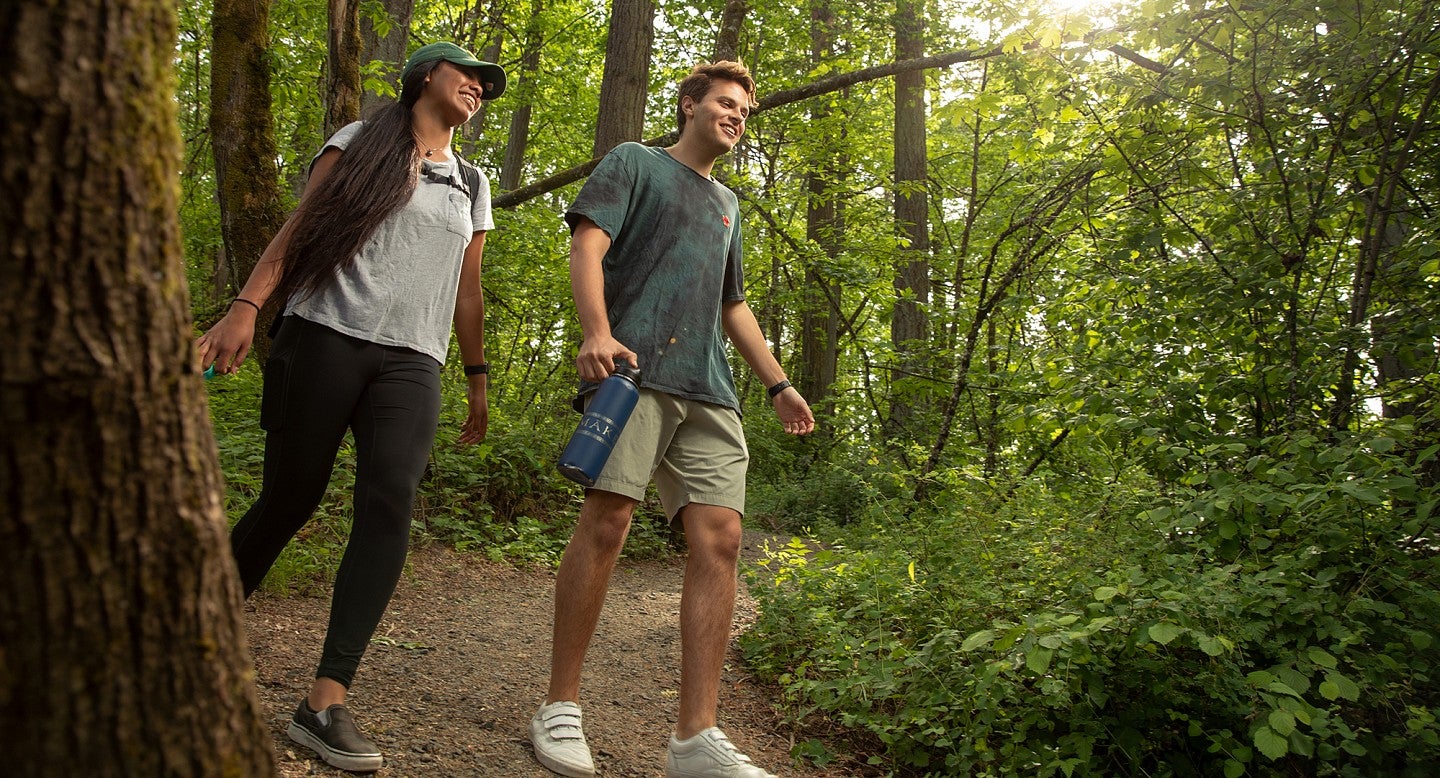 students hiking outside