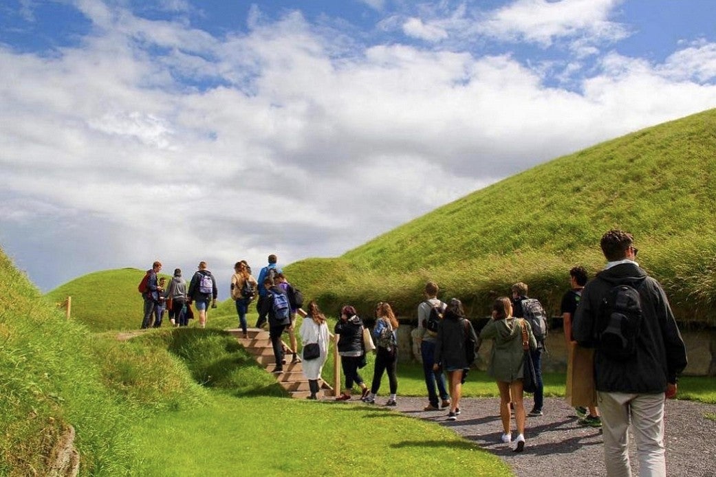 student group walking in Ireland hills