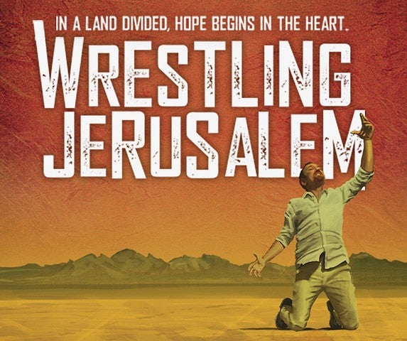 Person holding up their fists with the words "Wrestling Jerusalem"