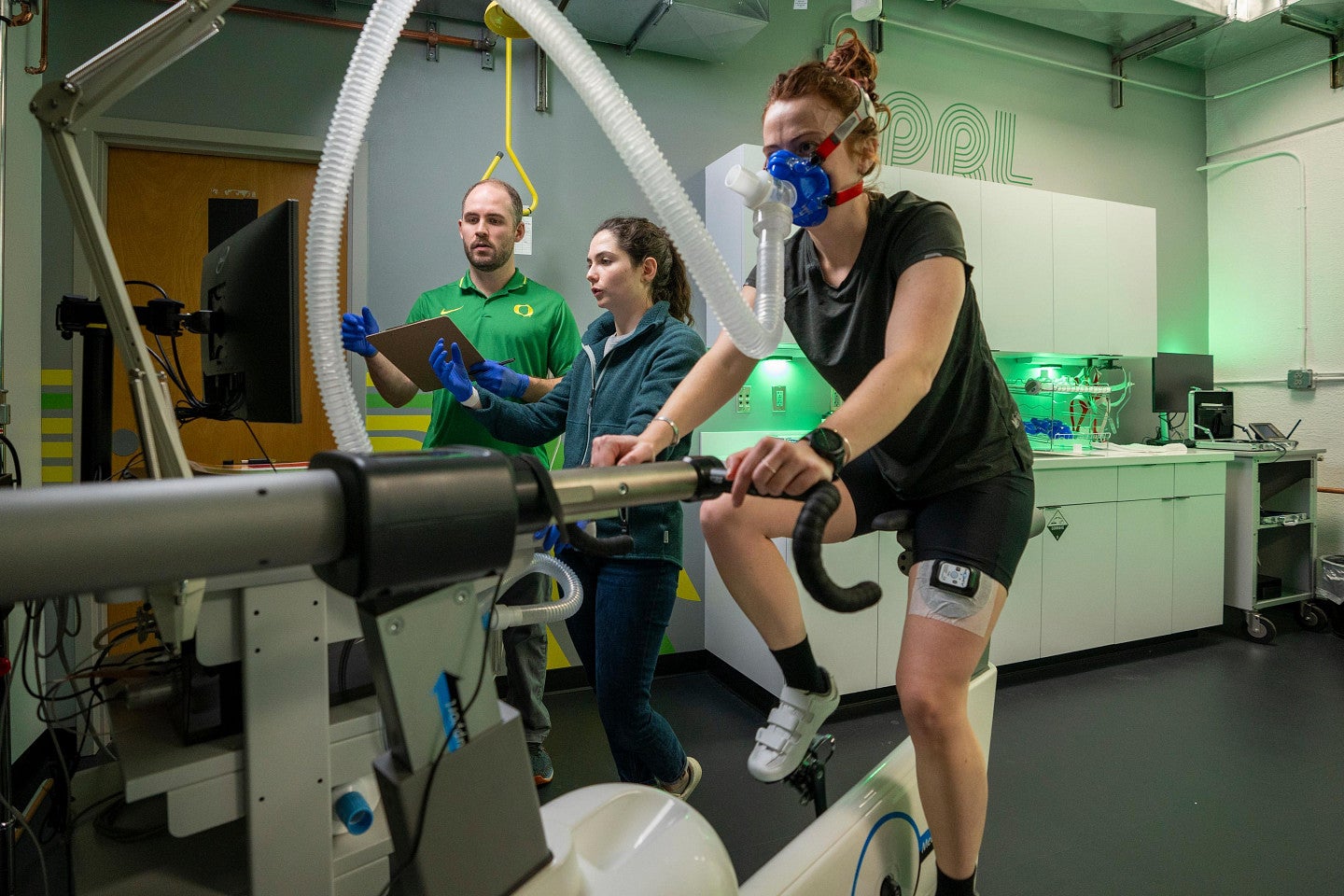 Researchers work with an athlete in the Oregon Performance Research Lab in Esslinger Hall.