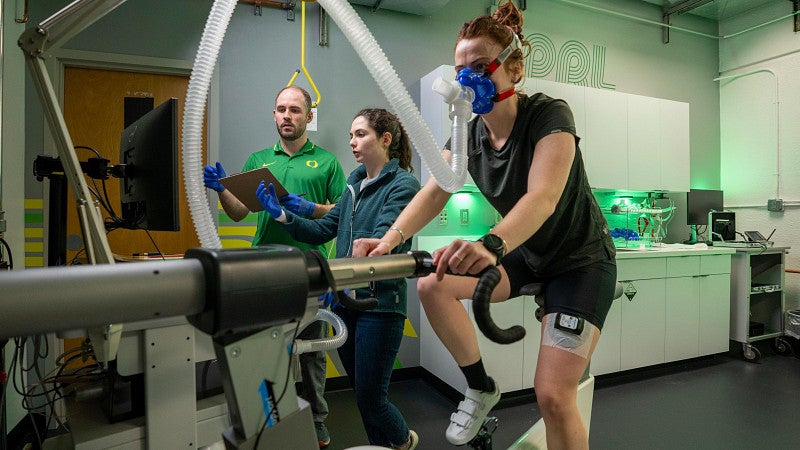 Researchers work with an athlete in the Oregon Performance Research Lab in Esslinger Hall.