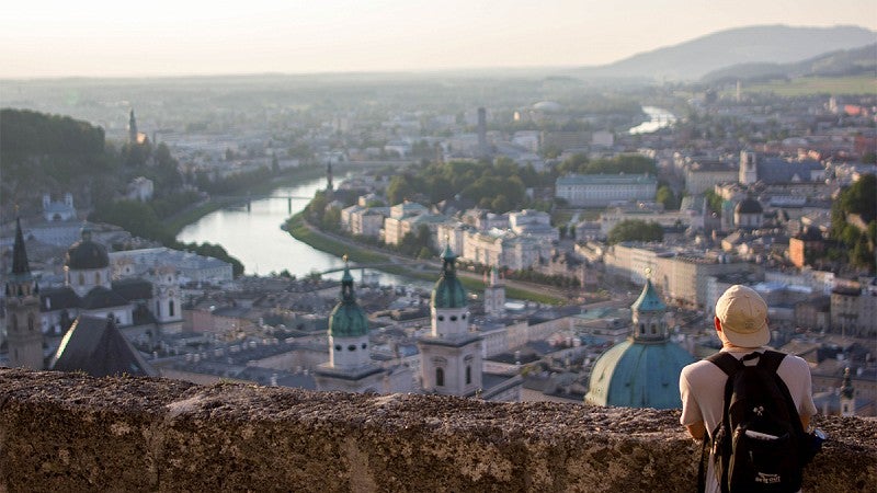 Student gazing at Salzburg during sunset