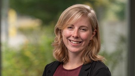 Headshot of Meaghan Bogart standing in greenery