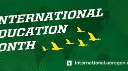 The words "International Education Month" with yellow flying ducks and a green background with a map of the world