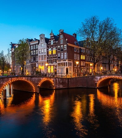 Canals of Amsterdam at night.