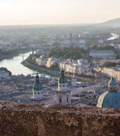 Student gazing at Salzburg during sunset