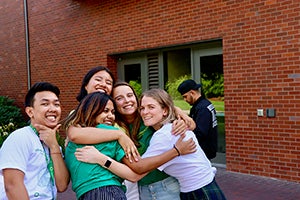 Britt and team hugging